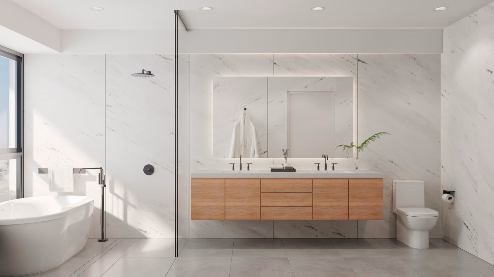 A spacious, well-lit bathroom with sleek, modern fixtures. In the foreground, a Renotive vanity with a granite countertop and a vessel sink. Overhead, a stylish pendant light casts a warm glow. The middle ground features a freestanding tub with brushed nickel faucets, surrounded by subway tile walls. In the background, a large window offers natural light and a view of lush greenery outside. The overall atmosphere conveys a sense of luxury, tranquility, and attention to detail, reflecting the high-end costs associated with a comprehensive bathroom remodel.