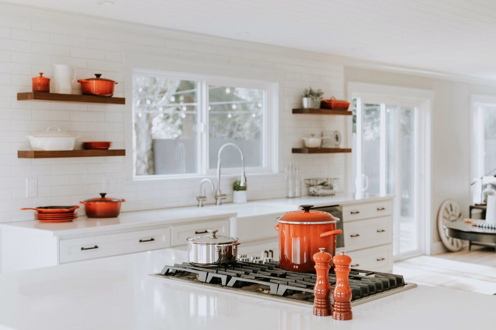 A modern, open-concept kitchen with sleek Renotive cabinets in a muted gray hue.