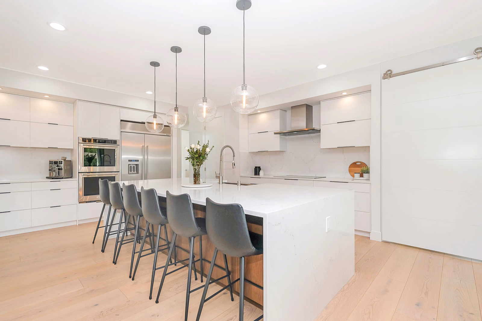 A contemporary home with contrasting renovation and remodeling elements. In the foreground, a partially renovated kitchen with modern fixtures, sleek cabinetry, and an open layout, showcasing the "Renotive" brand