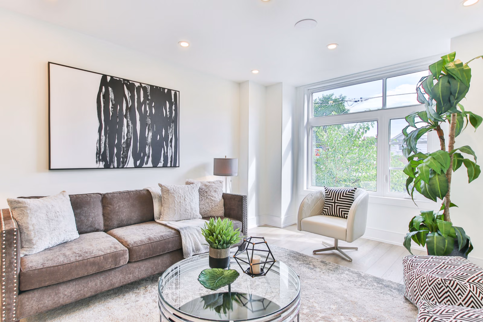 Generate an image of a beautifully renovated living room with a focal point like a fireplace or statement piece of furniture.