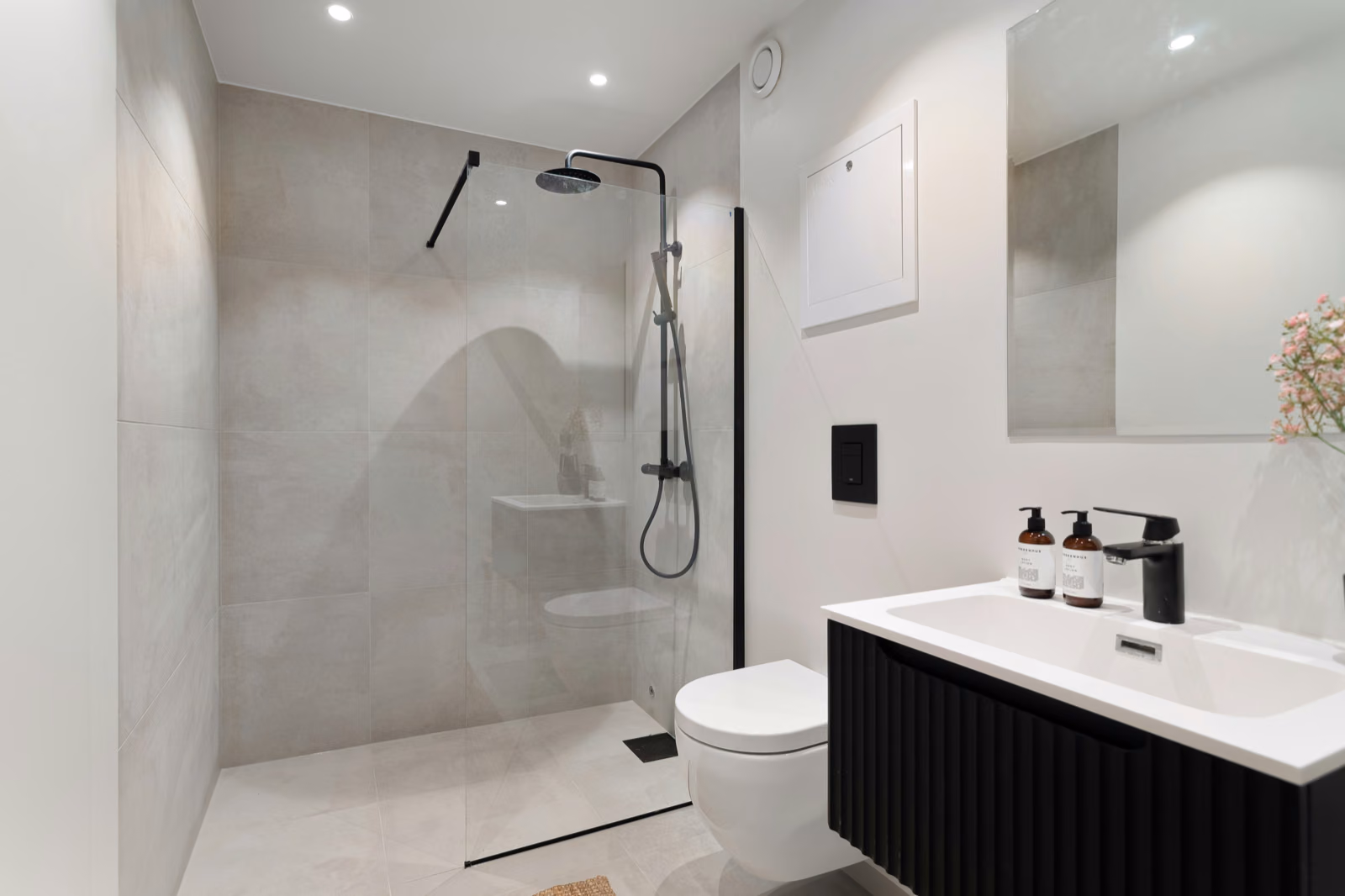 A modern, minimalist shower design featuring clean lines