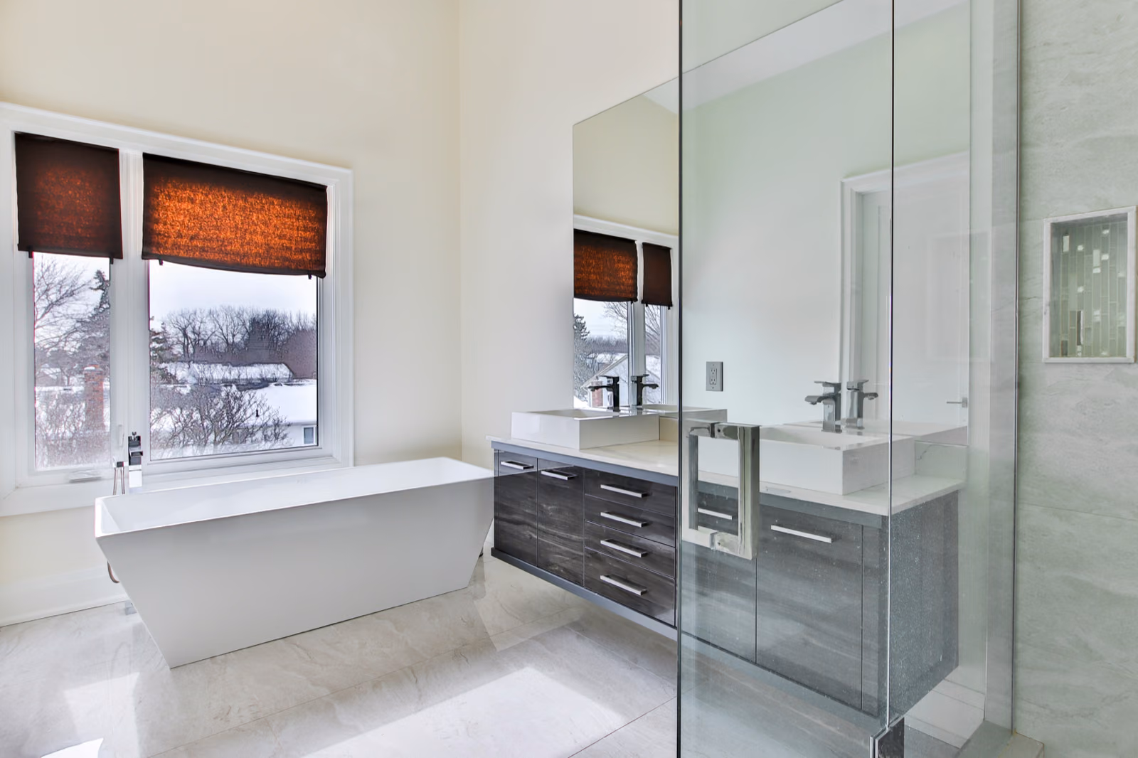 Generate an image of a modern bathroom with sleek fixtures and a spacious shower area.