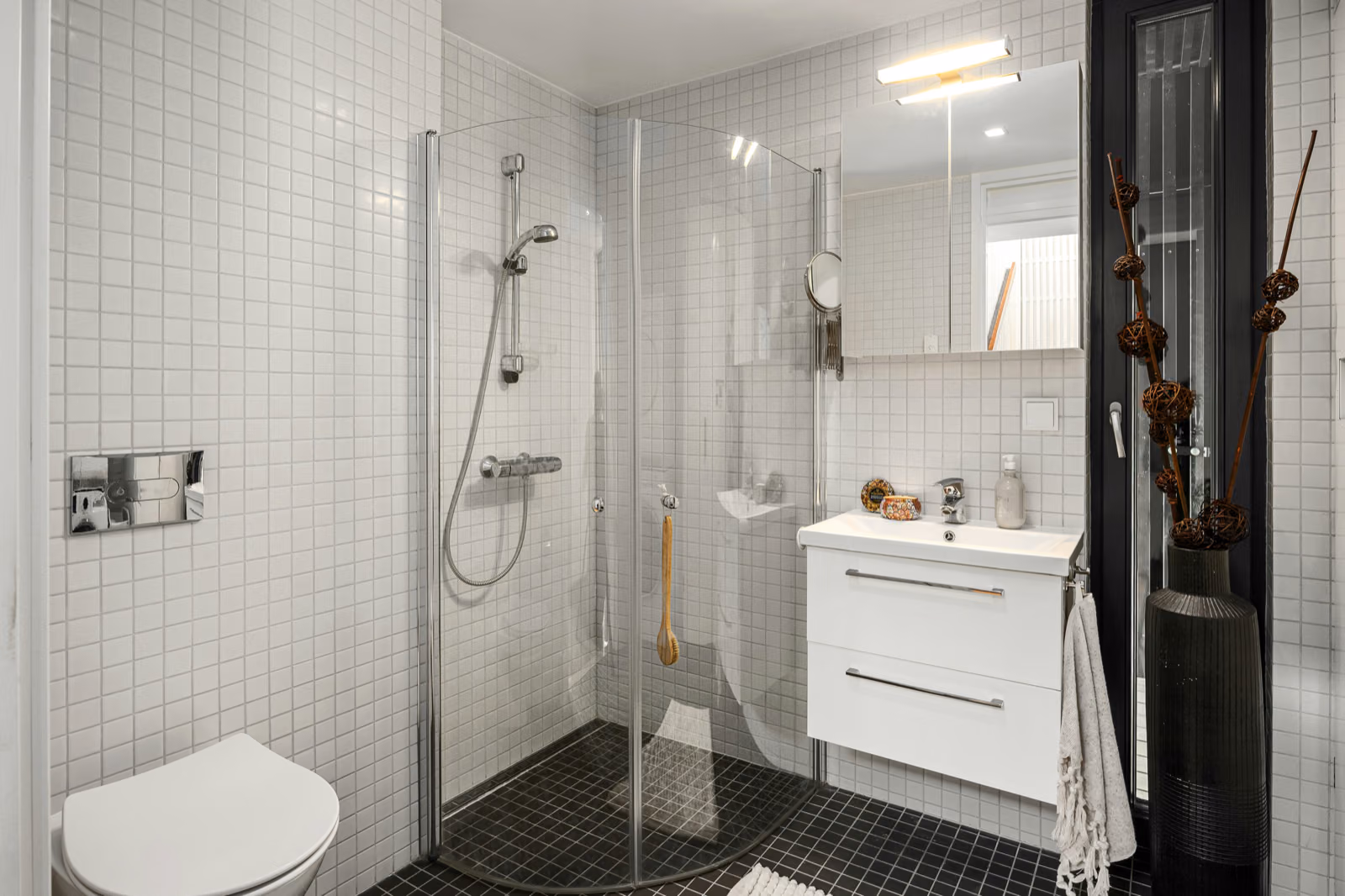 Image of a bathroom with grab bars and a curbless shower