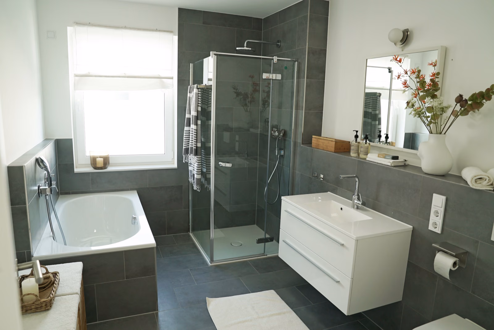 Modern 34 bathroom with gold faucets and glazed shower doors
