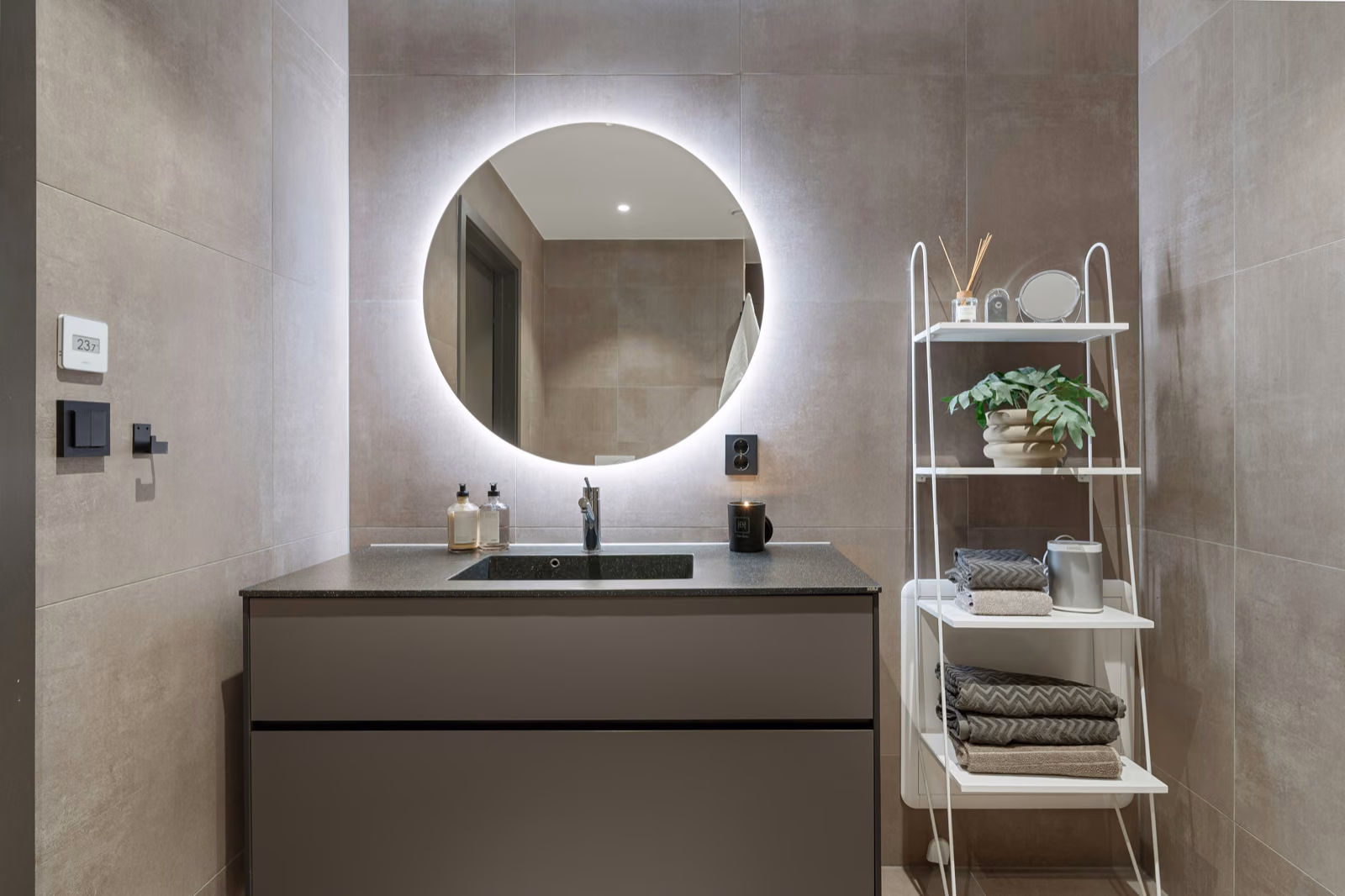 An LED-lit mirror in a modern bathroom