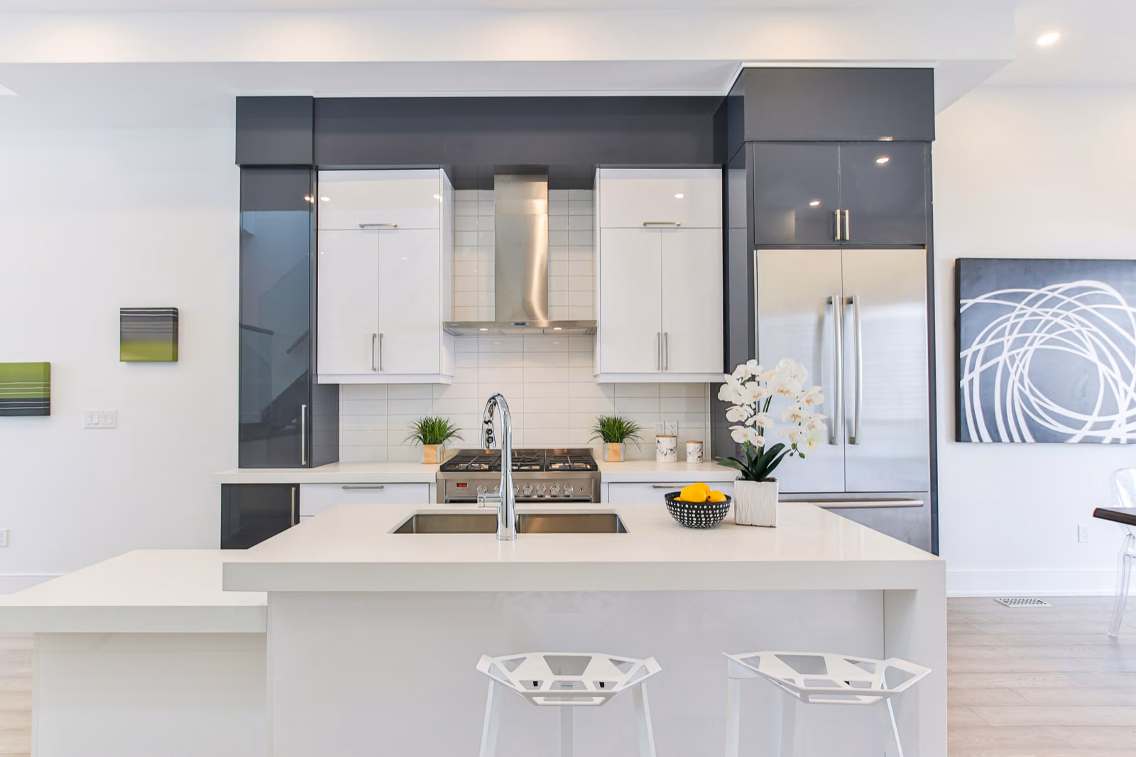 A warm, inviting interior of a remodeled home, illuminated by natural light streaming through large windows.