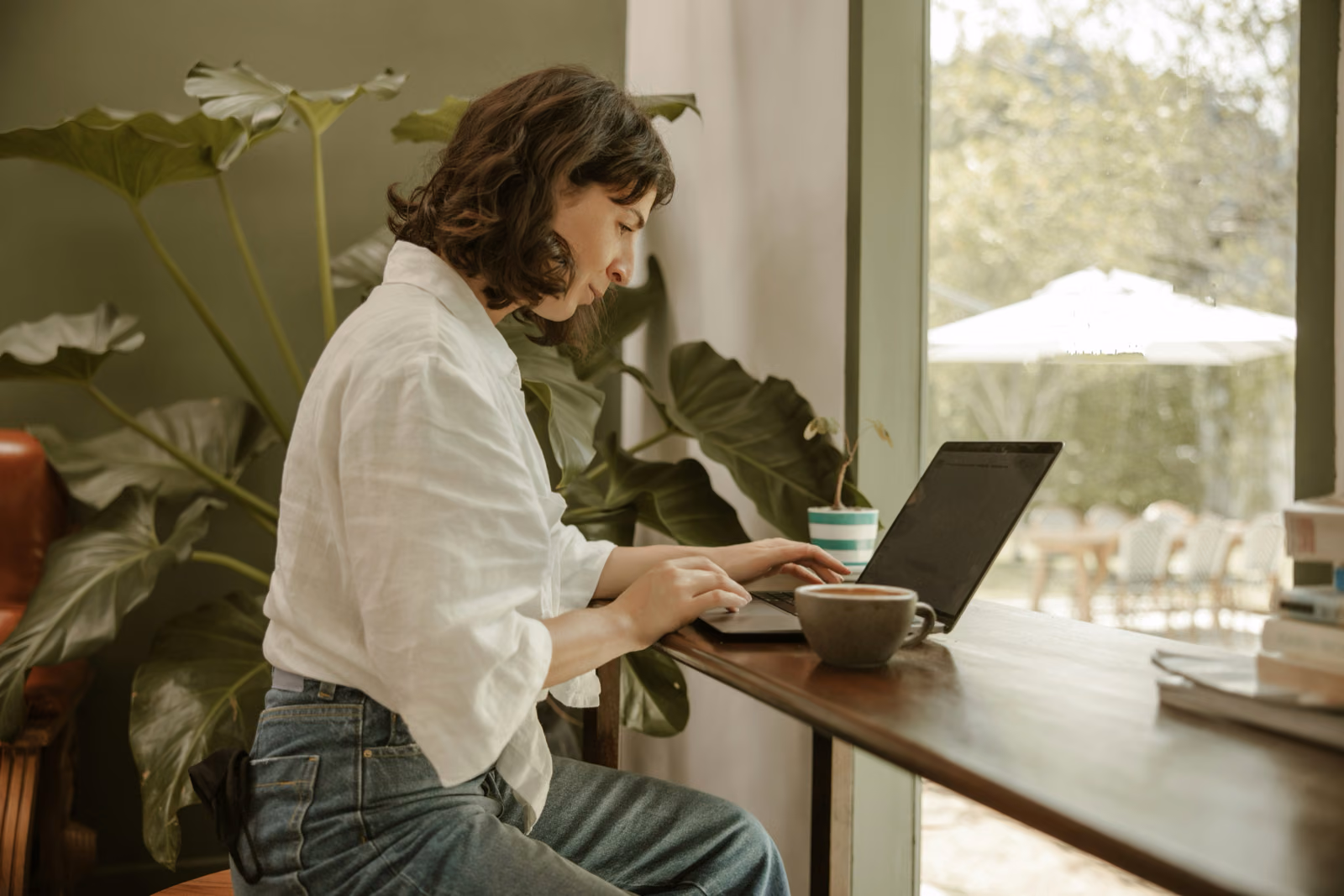 Generate an image of a person browsing through a home renovation blog on their laptop