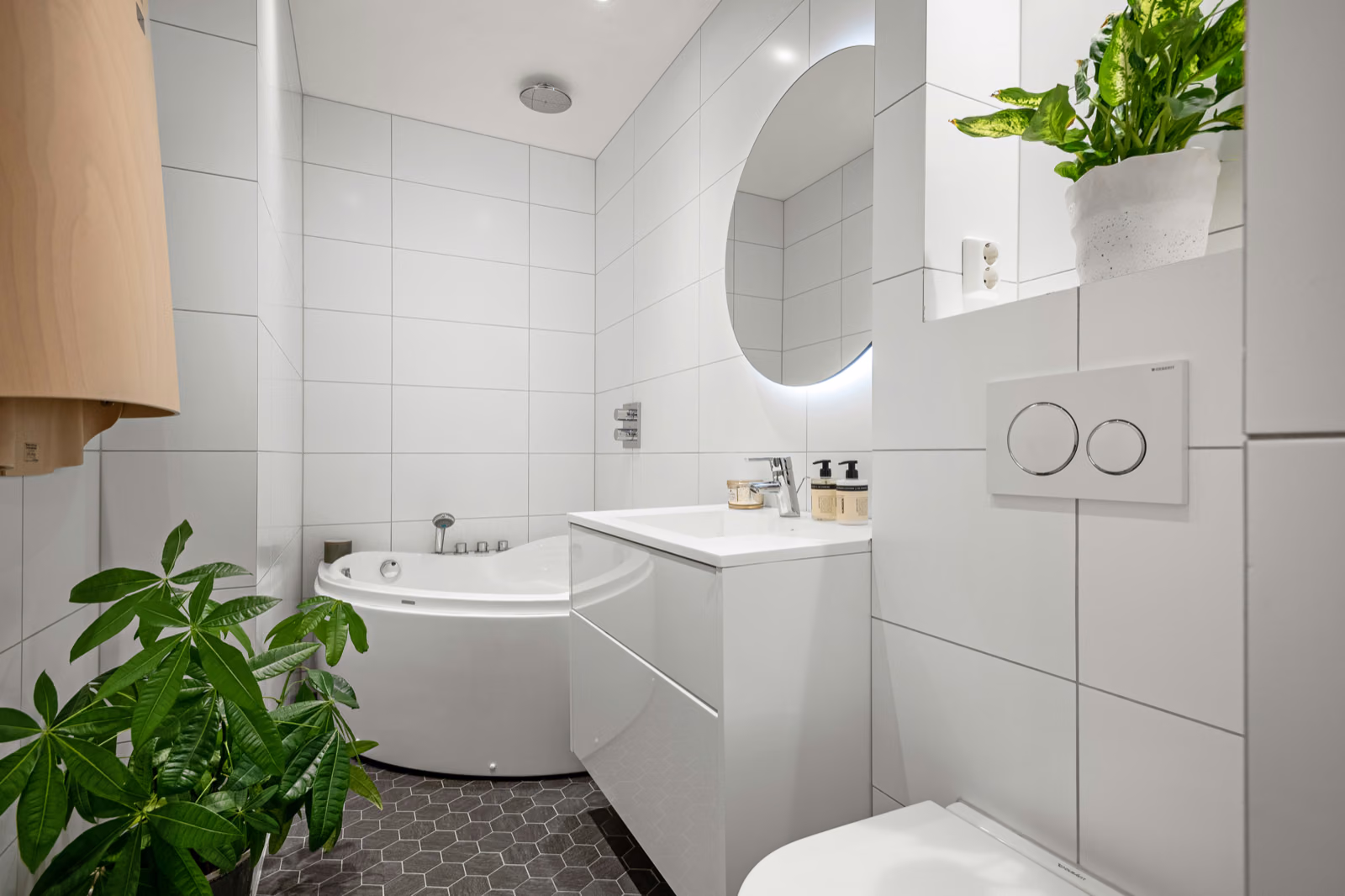 Image of a modern bathroom renovation with high-end fixtures and sleek design
